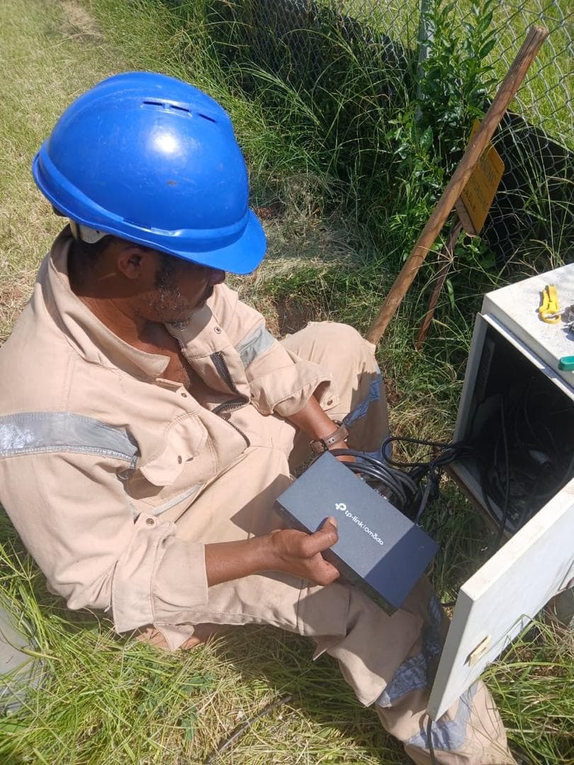Commissioning a managed switch inside a weatherproof field cabinet.
