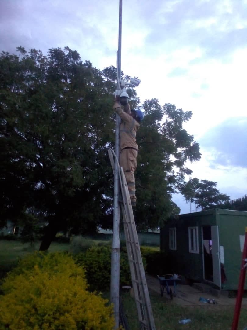 Aligning a pole-mounted dome so coverage still works once the light drops.